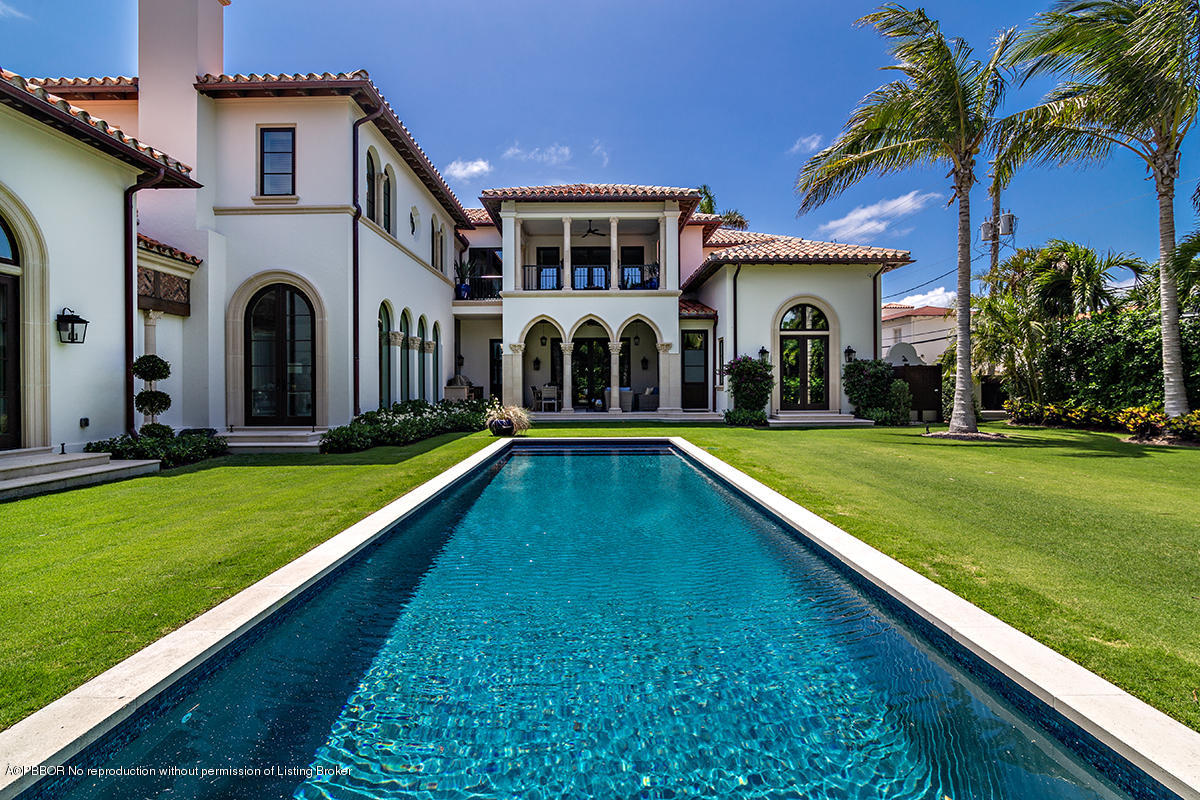 8 Golfview Road Palm Beach, FL 33480 - Photo 48 of 61 a view of a house with a swimming pool and a large tree
