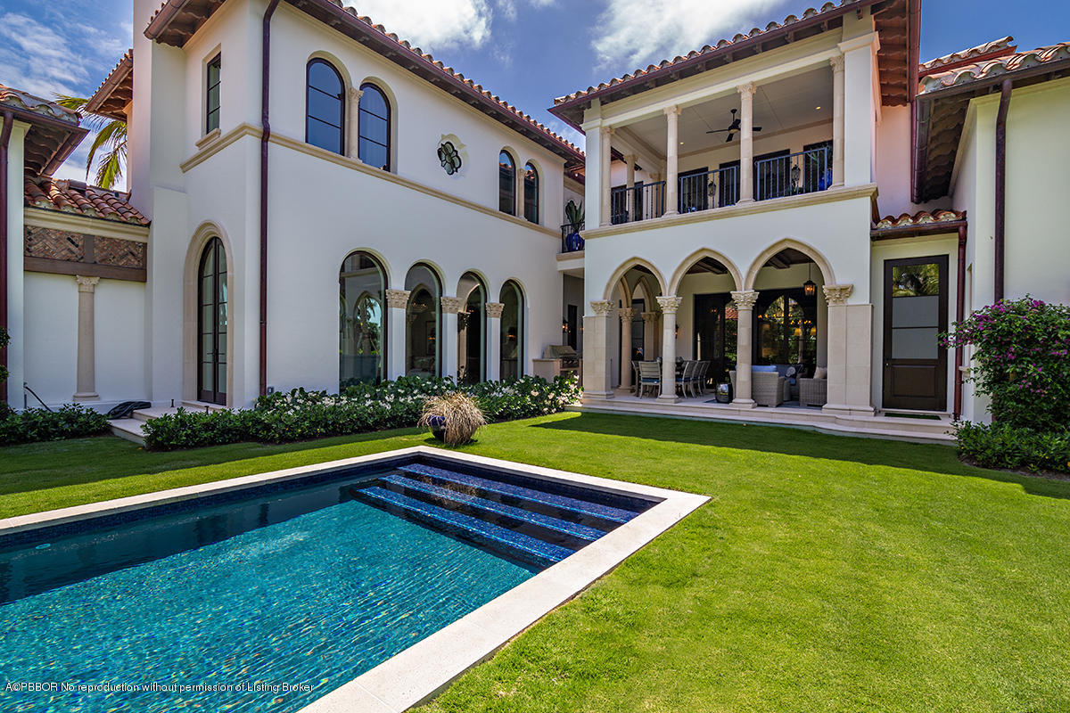 8 Golfview Road Palm Beach, FL 33480 - Photo 49 of 61 a view of a house with swimming pool and a yard
