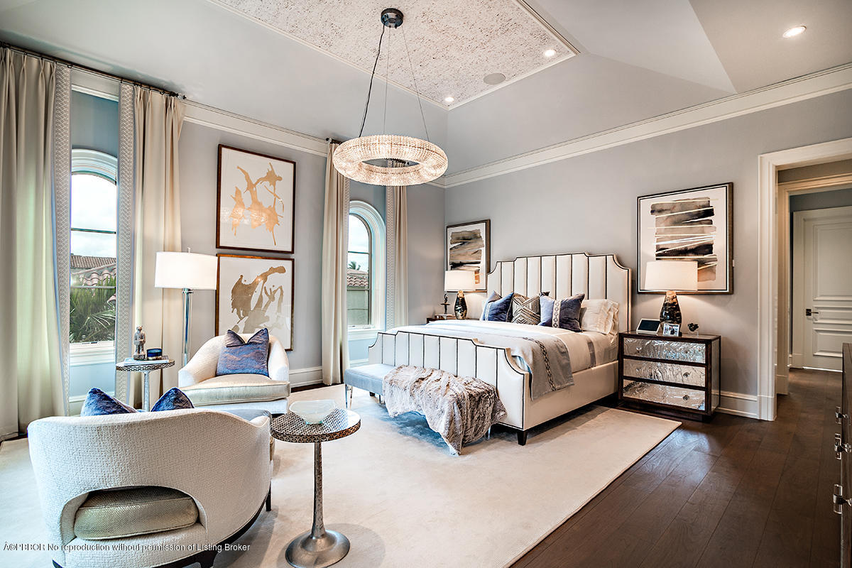 8 Golfview Road Palm Beach, FL 33480 - Photo 6 of 61 a spacious bedroom with a bed and a chandelier