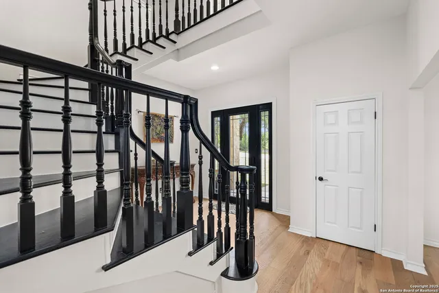 a view of entryway with stairs and wooden floor
