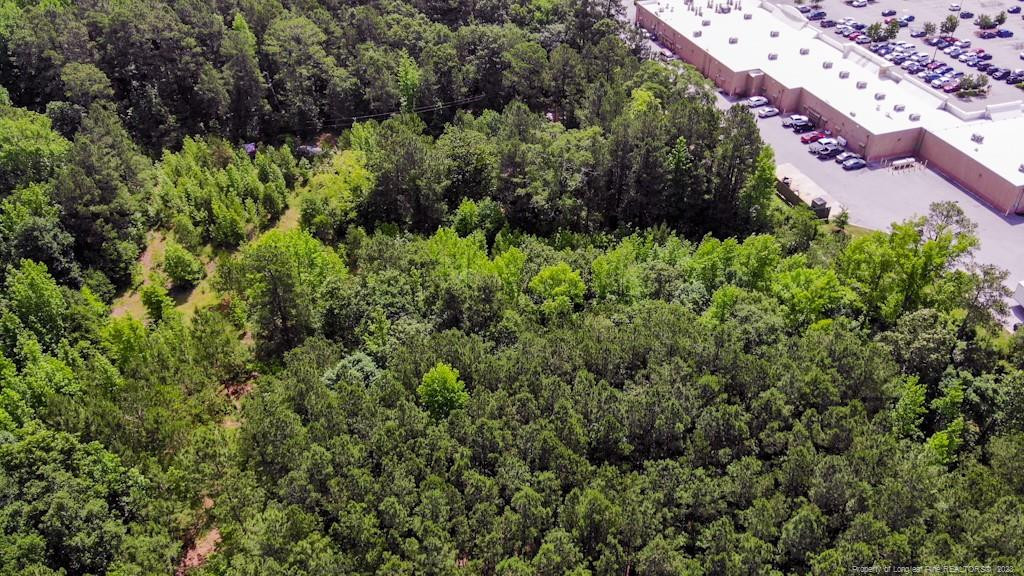24-87 Nc Cameron, NC 28326 - Photo 14 of 28 an aerial view of residential house with outdoor space and trees all around