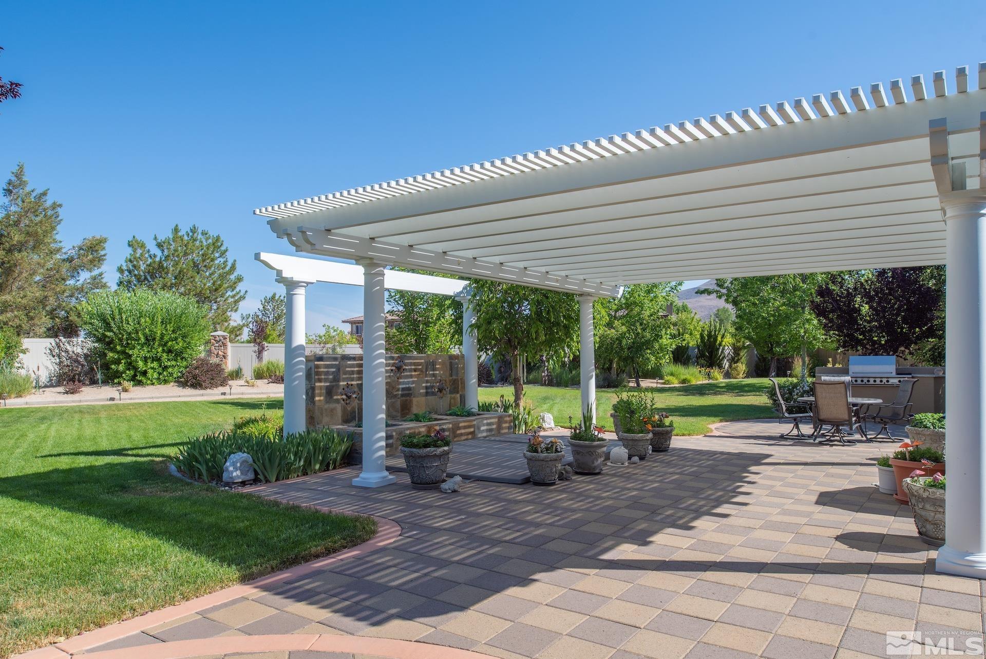 2635 Vitoria Lane Reno, NV 89521 - Photo 25 of 40 a view of a patio with a garden