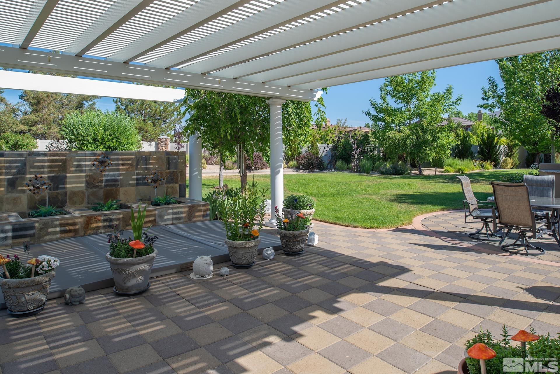 2635 Vitoria Lane Reno, NV 89521 - Photo 27 of 40 a view of a patio with chairs and plants