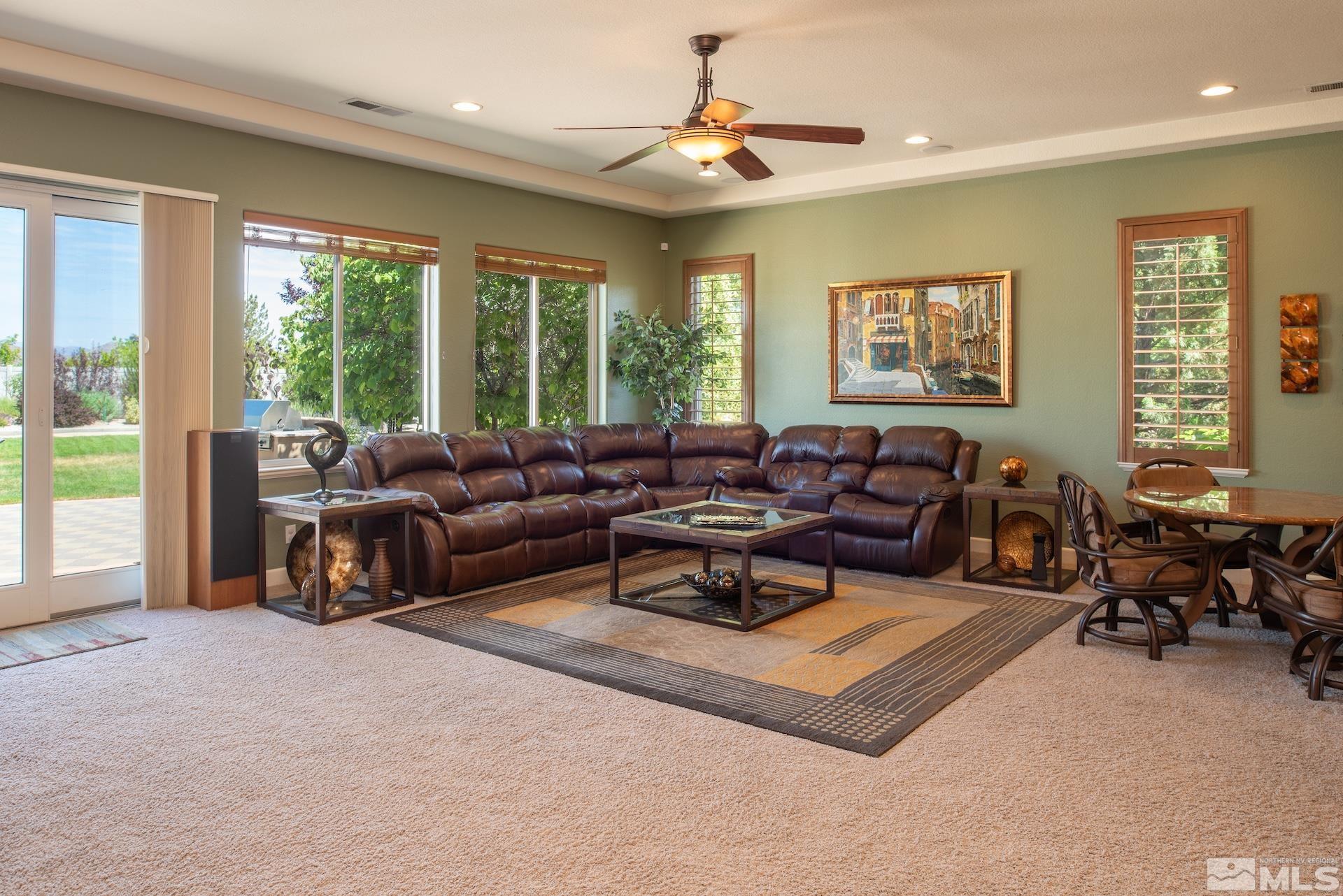 2635 Vitoria Lane Reno, NV 89521 - Photo 4 of 40 a living room with furniture a rug and a large window