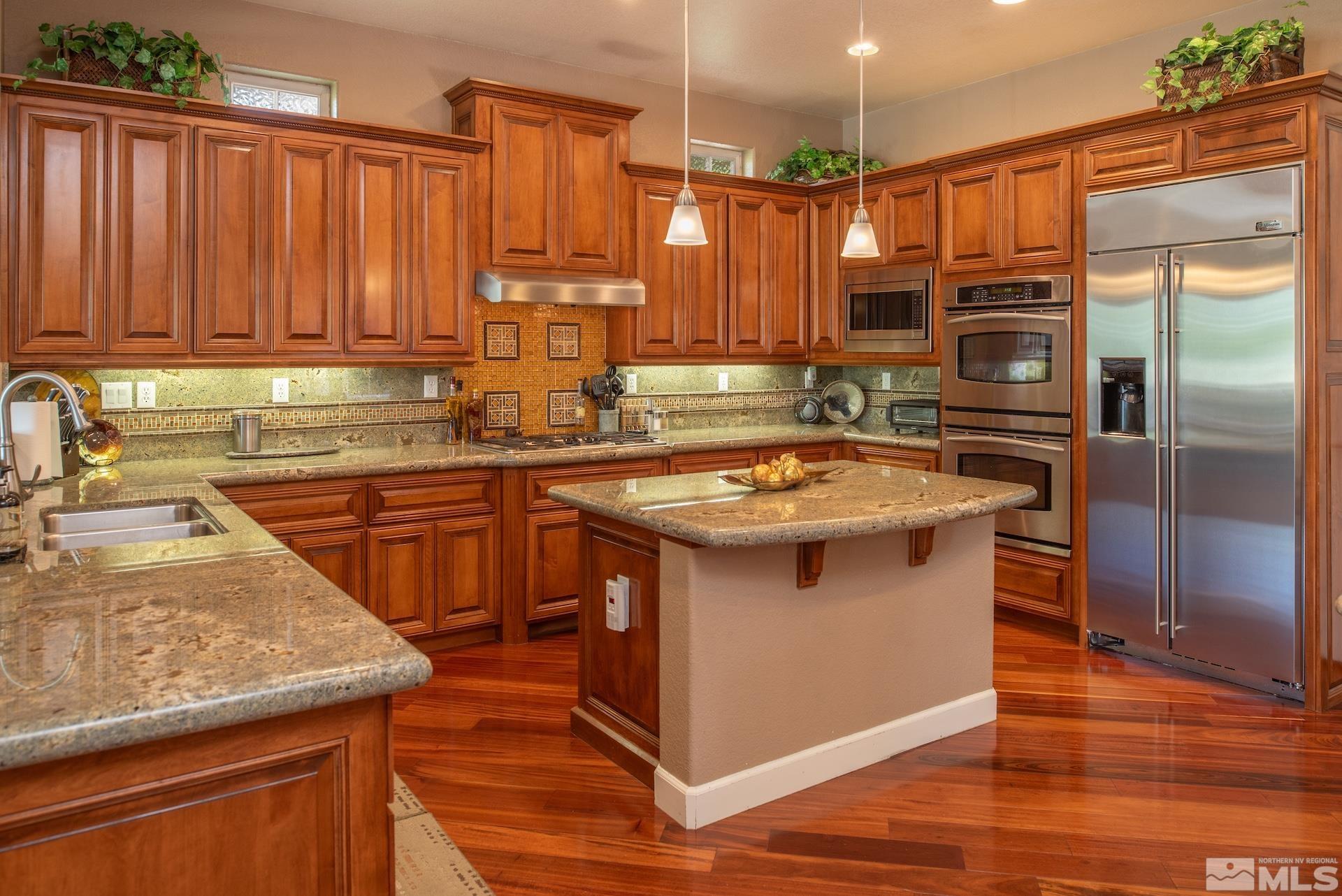 2635 Vitoria Lane Reno, NV 89521 - Photo 8 of 40 a kitchen with a sink stove and cabinets