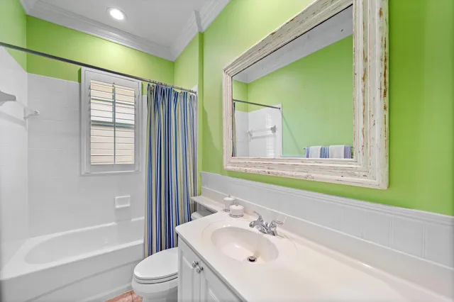 a bathroom with a sink toilet and tub