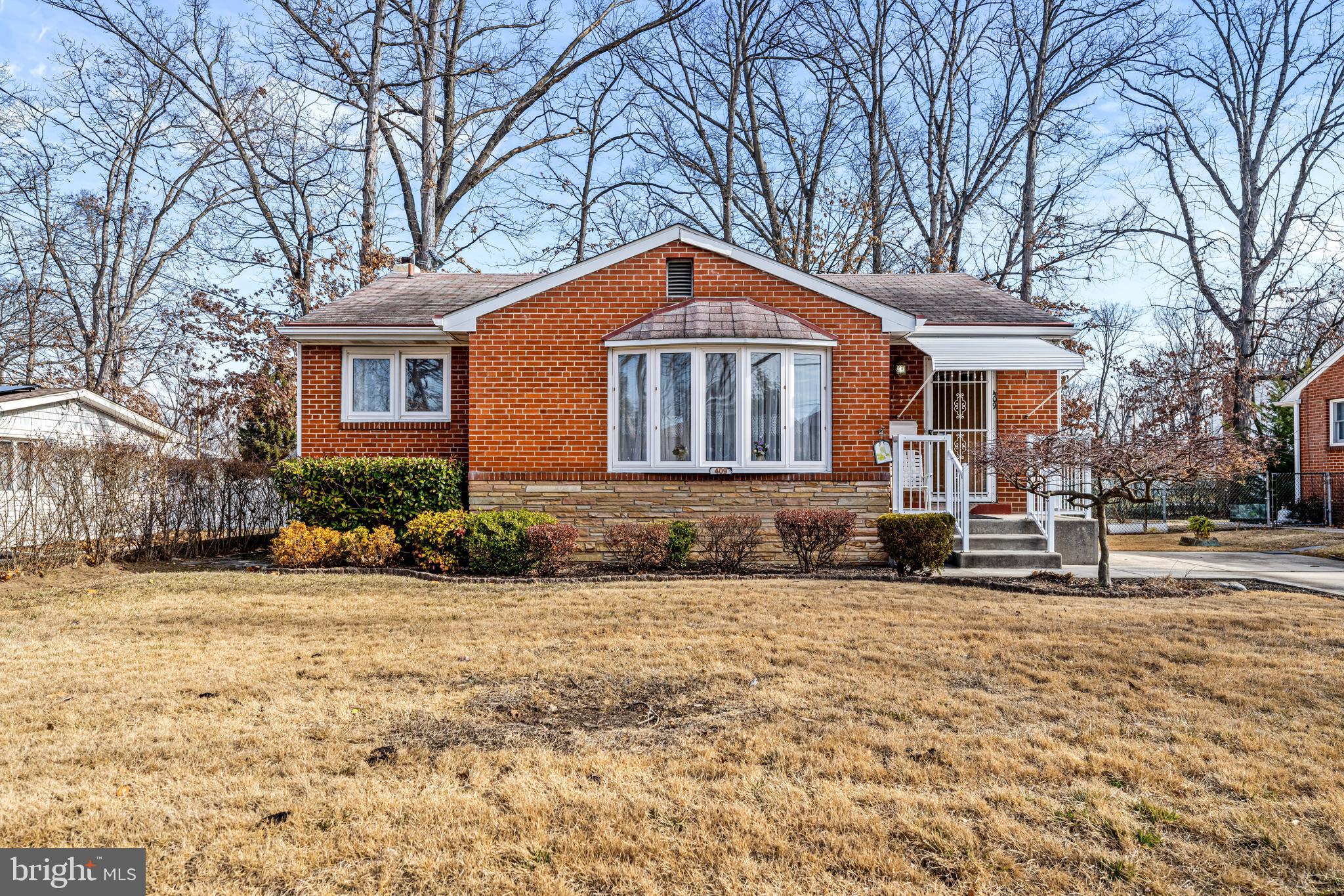 409 Arch Street Delran, NJ 08075 - Photo 1 of 36 a front view of a house with a yard