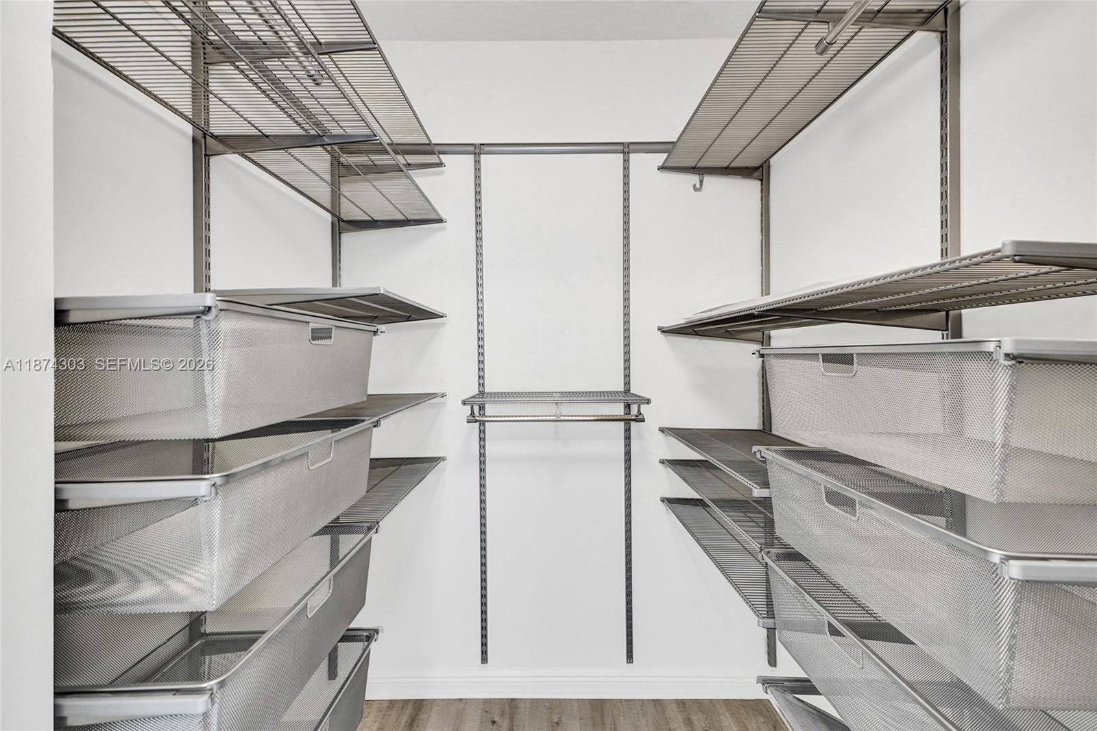 888 Douglas Road, Unit 304 Coral Gables, FL 33134 - Photo 29 of 52 a view of a room with racks on the wall