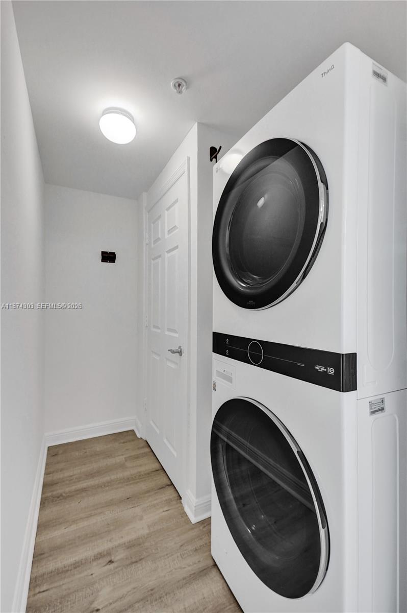 888 Douglas Road, Unit 304 Coral Gables, FL 33134 - Photo 34 of 52 a utility room with dryer and washer