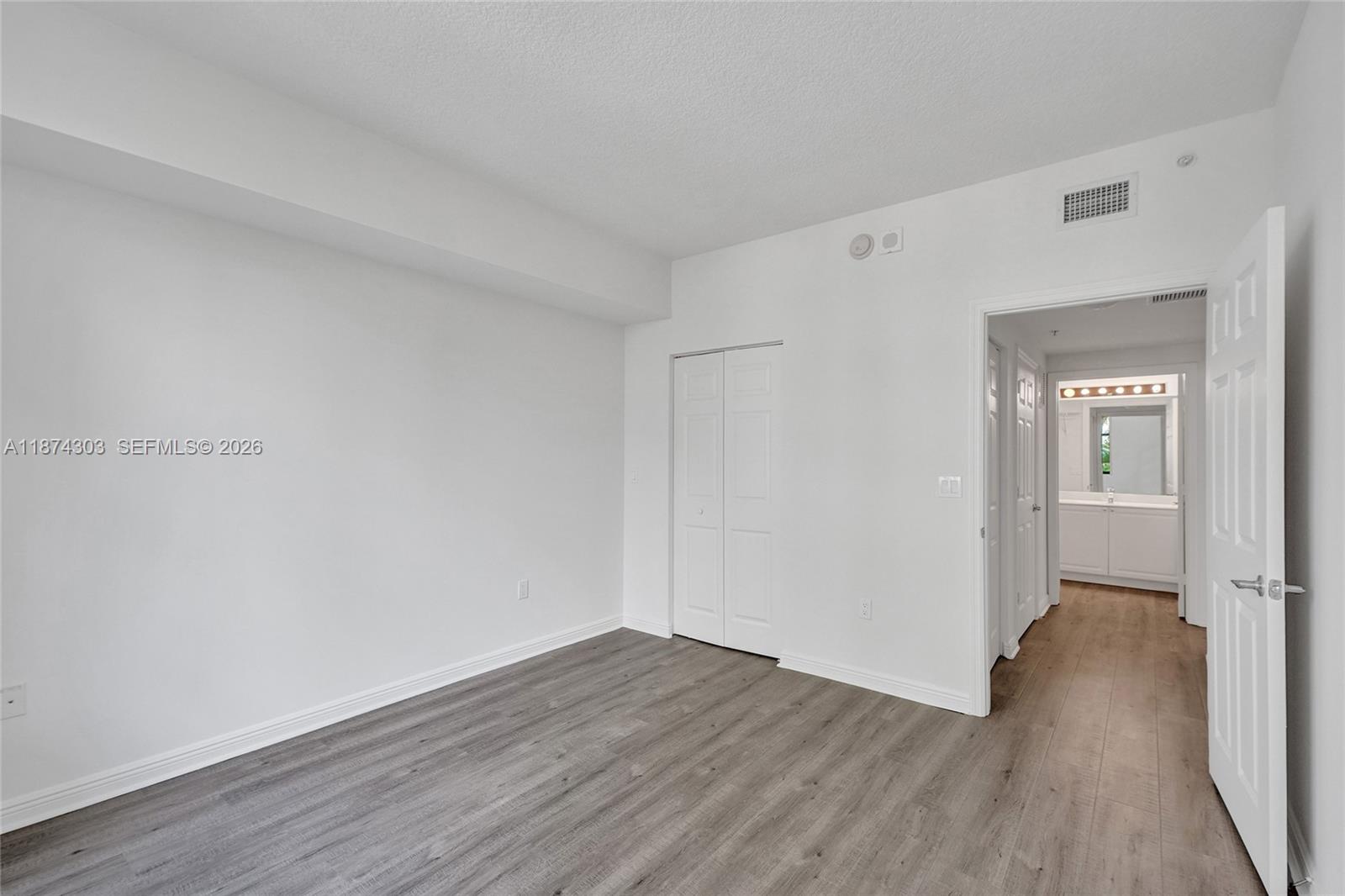 888 Douglas Road, Unit 304 Coral Gables, FL 33134 - Photo 37 of 52 a view of a livingroom with wooden floor