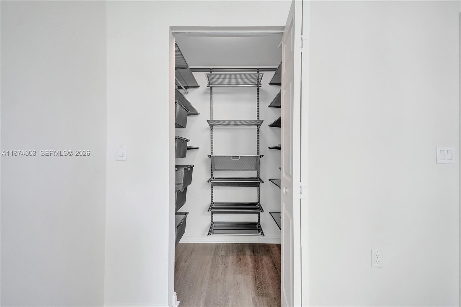 888 Douglas Road, Unit 304 Coral Gables, FL 33134 - Photo 41 of 52 a view of a room with rack on the wall