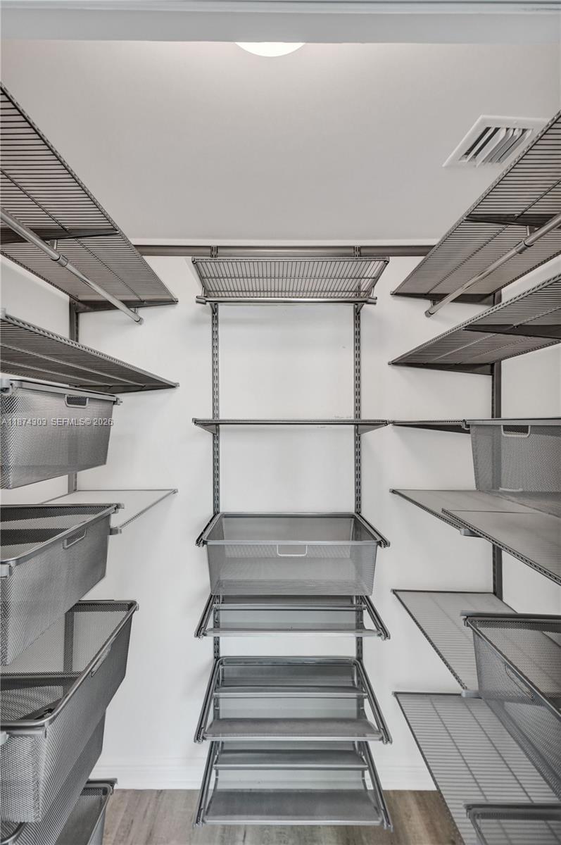 888 Douglas Road, Unit 304 Coral Gables, FL 33134 - Photo 42 of 52 a view of a room with racks on the wall