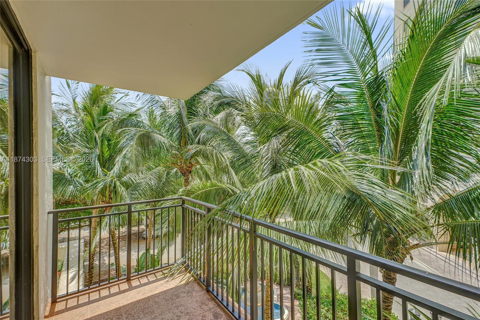 888 Douglas Road, Unit 304 Coral Gables, FL 33134 - Photo 43 of 52 a view of a balcony with a plant
