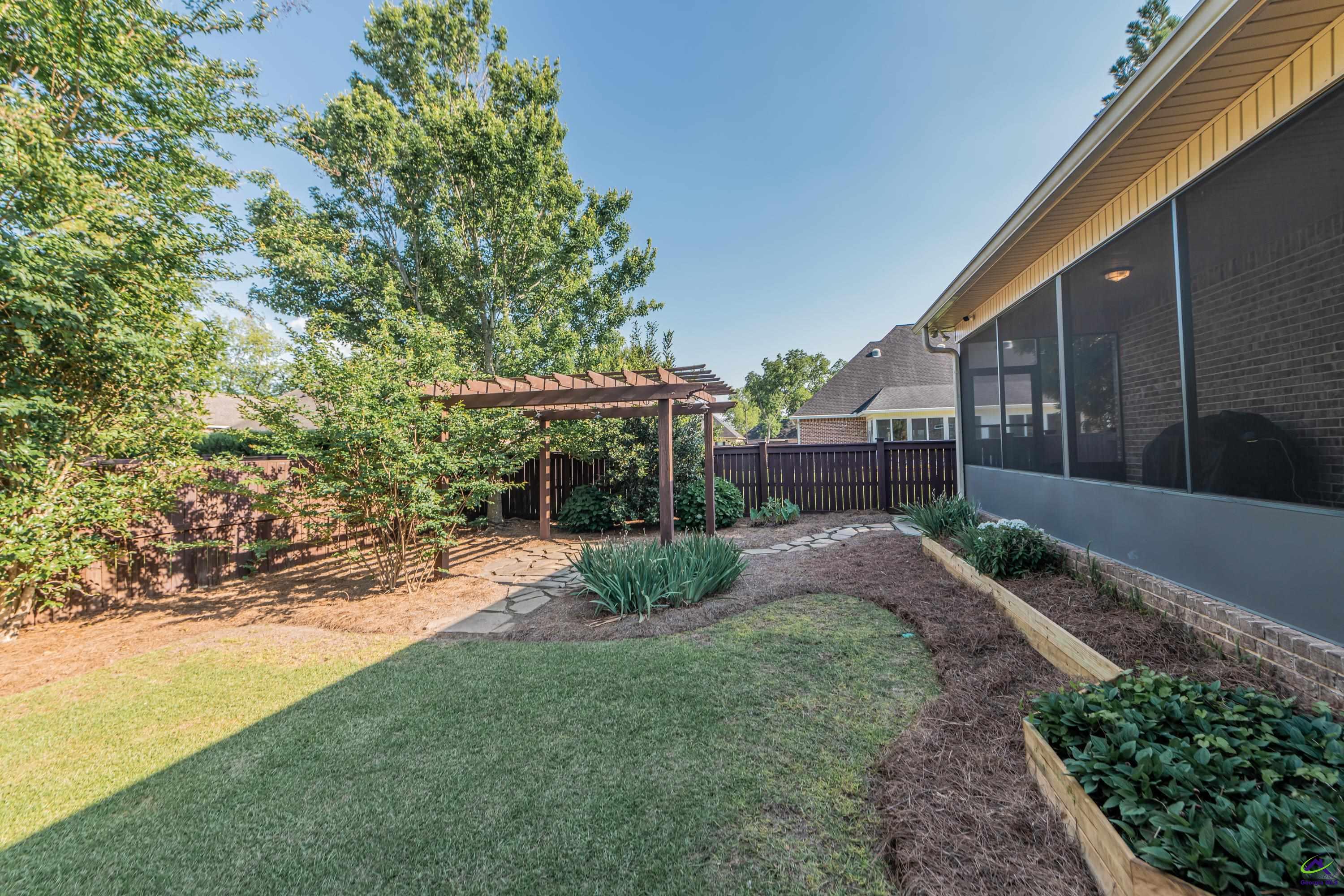 405 Old Bridge Road Warner Robins, GA 31088 - Photo 52 of 58 a view of backyard with table and chairs and plants