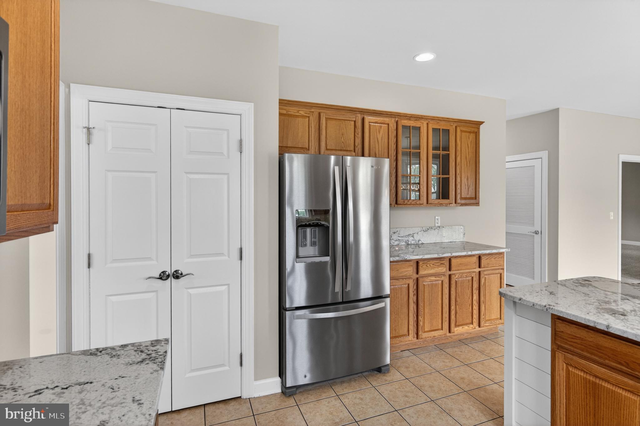 337 Roe Ingleside Road Centreville, MD 21617 - Photo 23 of 56 a kitchen with stainless steel appliances granite countertop a refrigerator and a sink
