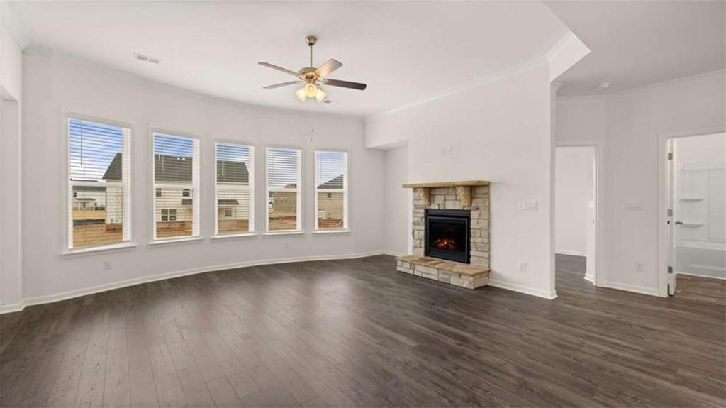 1791 Goodwin Drive Hampton, GA 30228 - Photo 16 of 43 a view of an empty room with wooden floor and a window