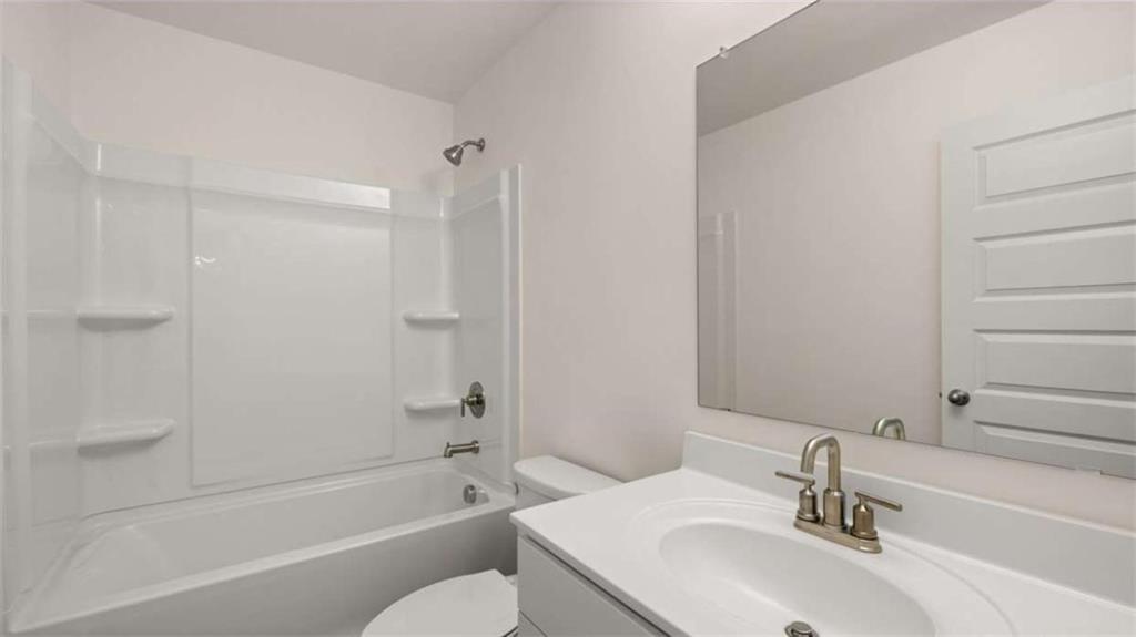 1791 Goodwin Drive Hampton, GA 30228 - Photo 43 of 43 a bathroom with a sink toilet and shower