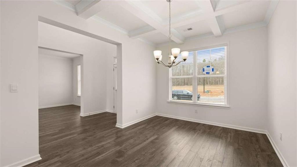 1791 Goodwin Drive Hampton, GA 30228 - Photo 7 of 43 an empty room with wooden floor and windows