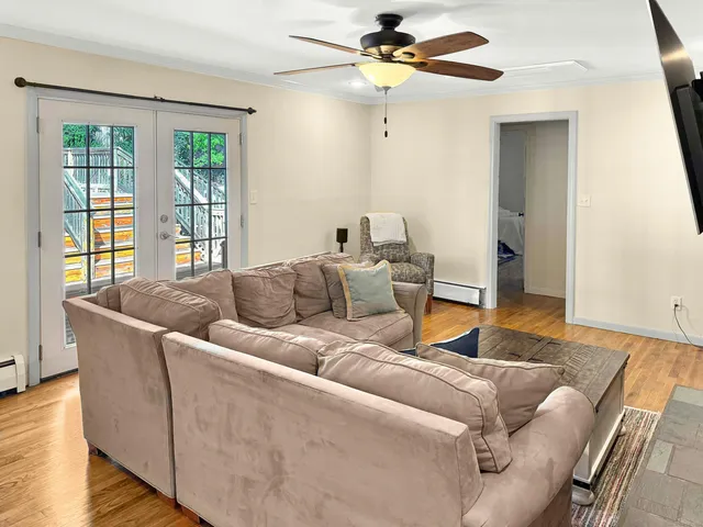 a living room with furniture and a window