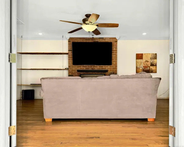 a living room with furniture and a flat screen tv