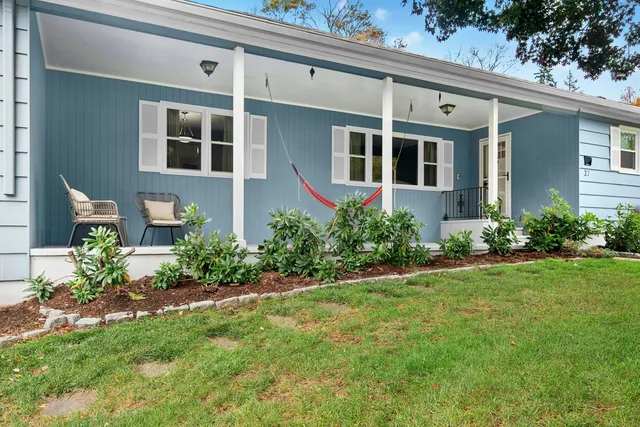 a front view of a house with a yard