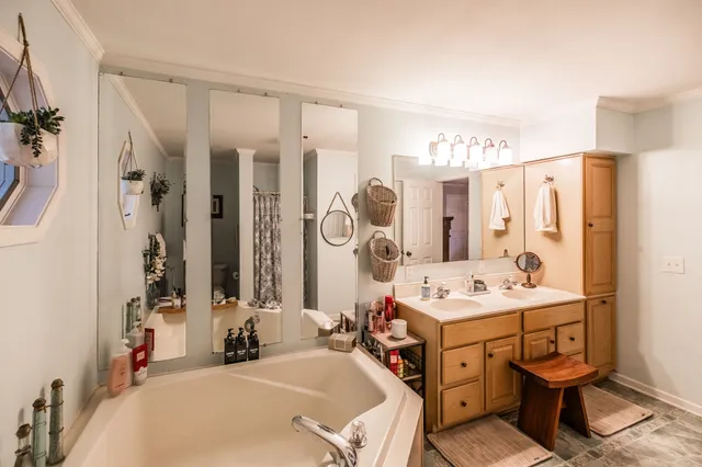 a bathroom with a sink double vanity and a mirror