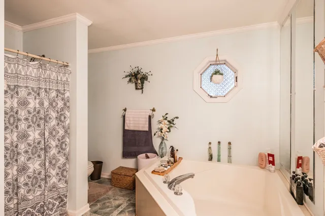 a bathroom with a sink vanity and a mirror