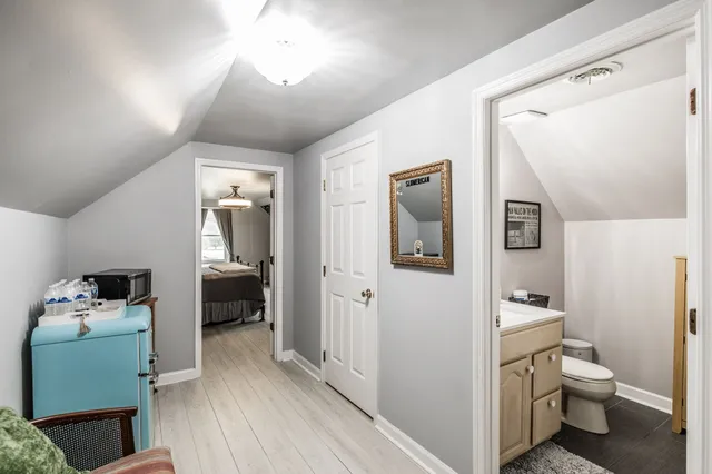 a en suite bathroom with a toilet sink and mirror