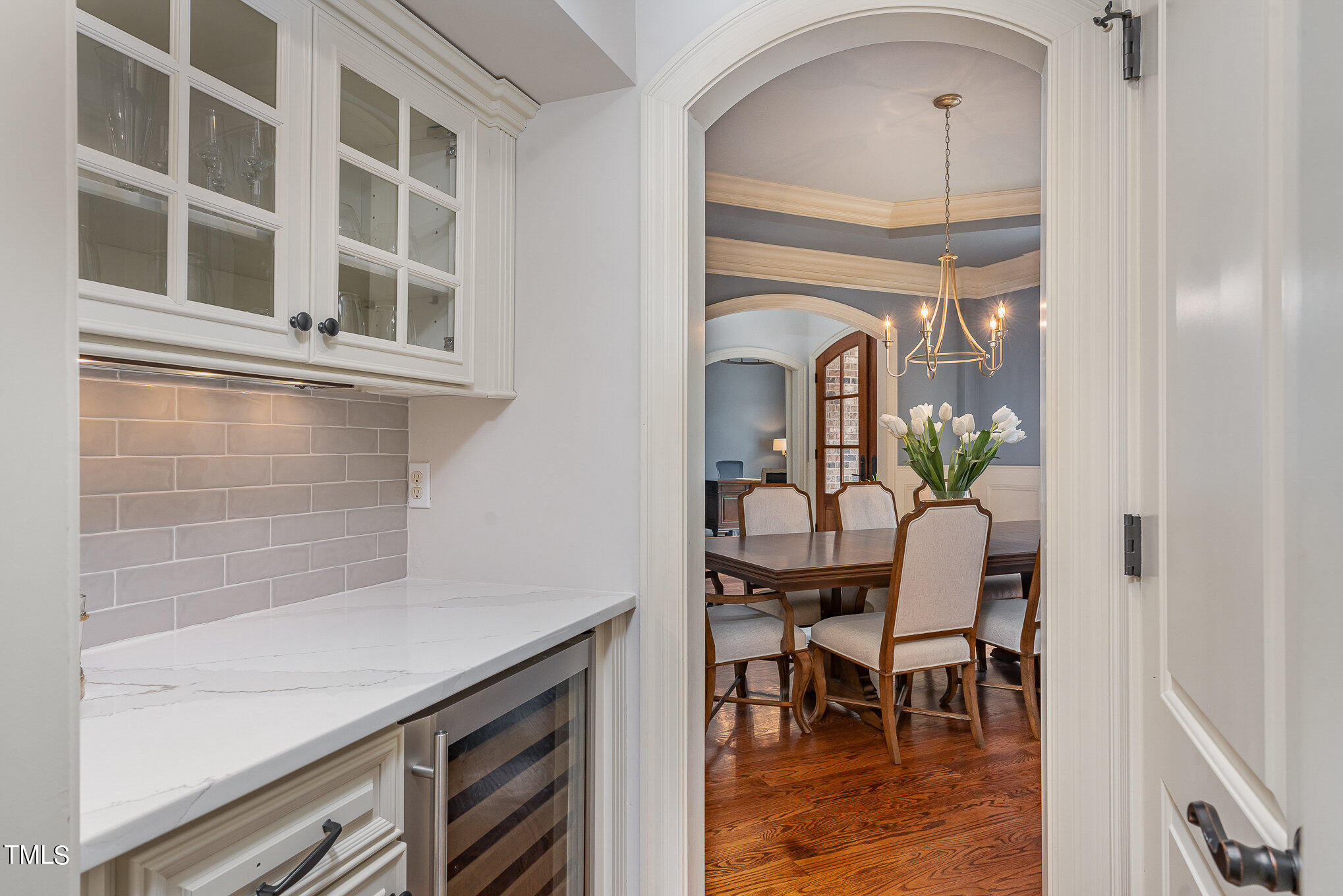 2908 Claremont Road Raleigh, NC 27608 - Photo 19 of 46 a view of a hallway with a dining table and chairs