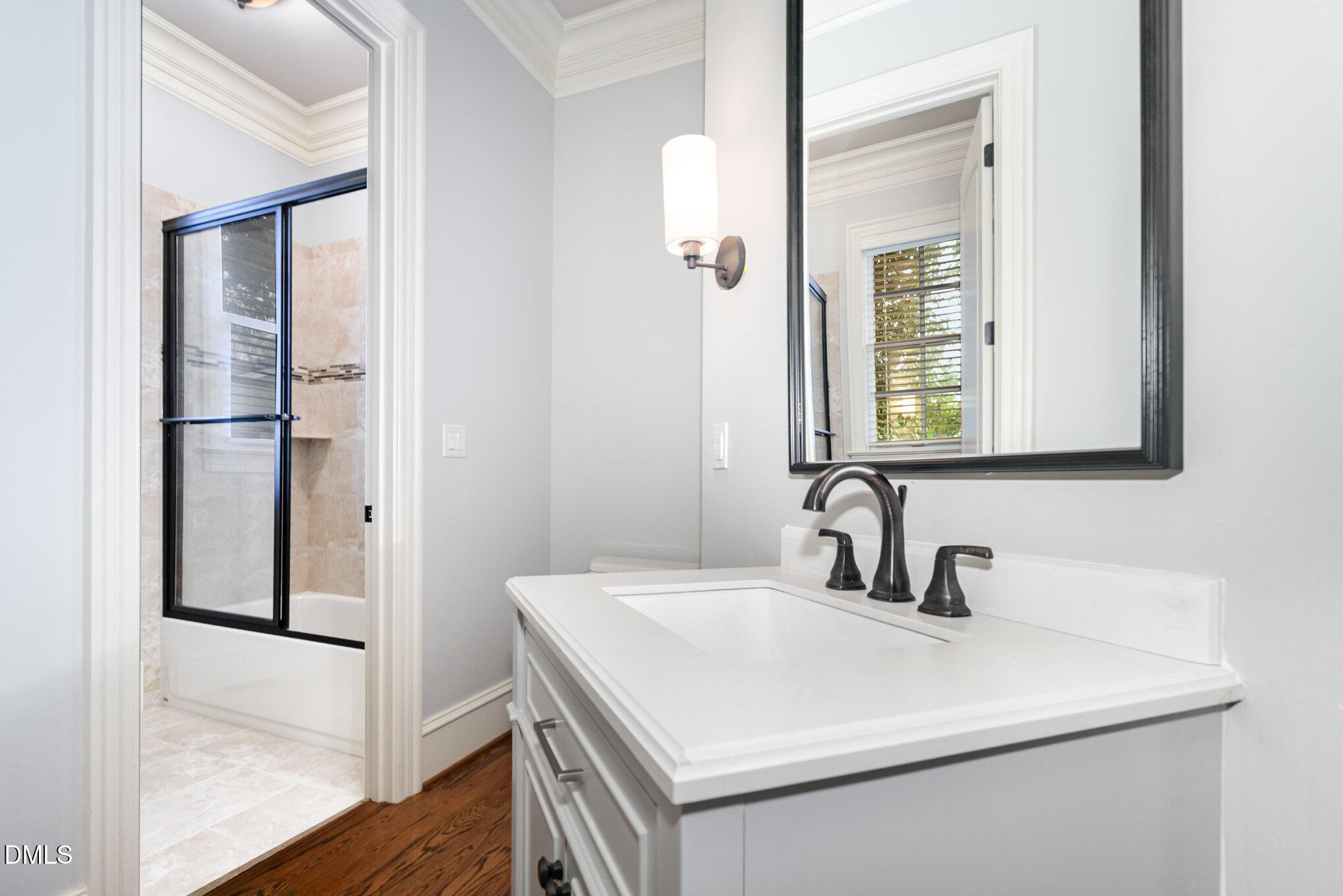 2908 Claremont Road Raleigh, NC 27608 - Photo 25 of 46 a bathroom with a sink and a mirror
