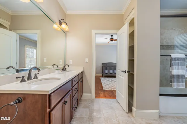 a bathroom with a sink double vanity and a mirror