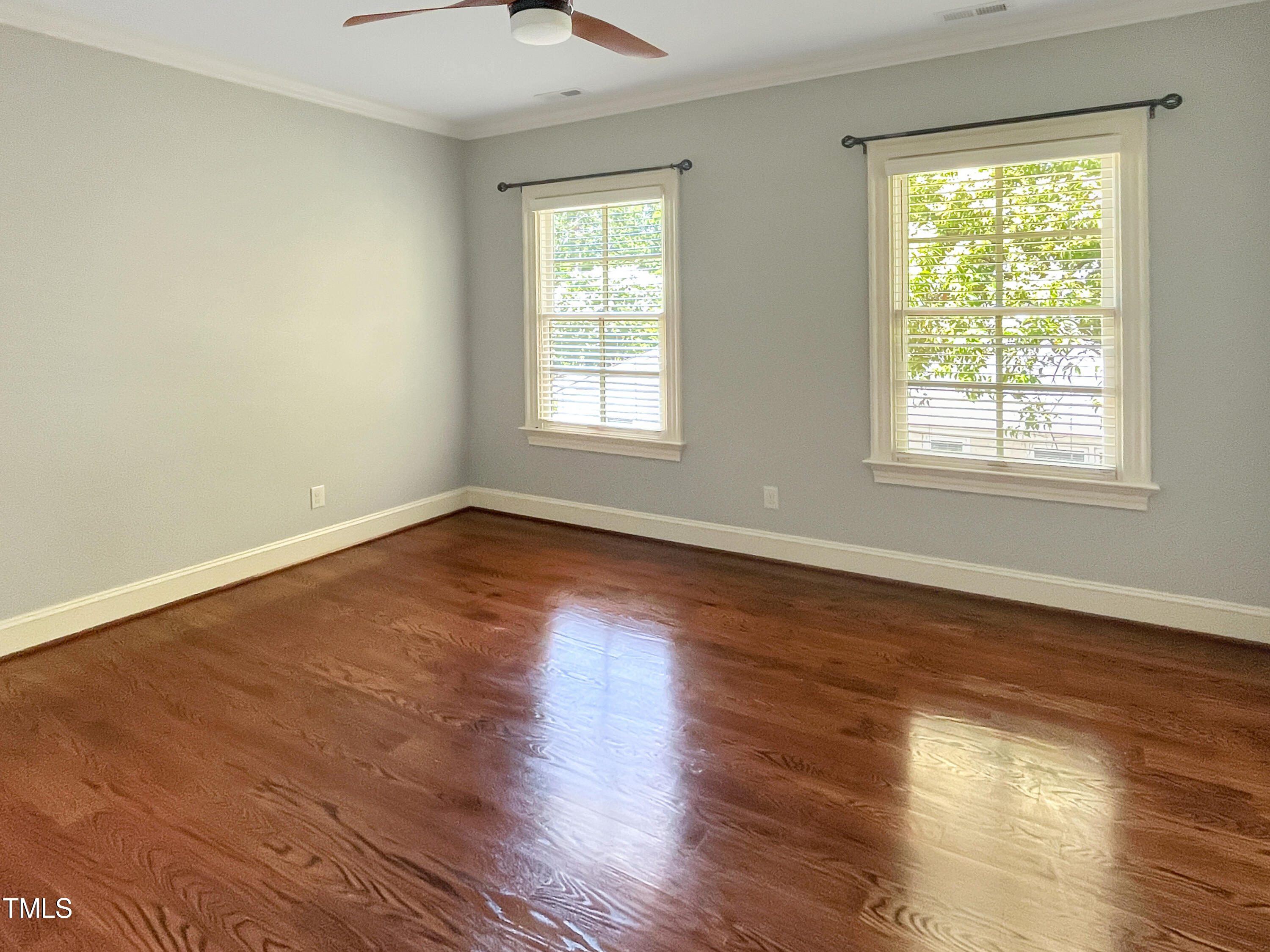 2908 Claremont Road Raleigh, NC 27608 - Photo 38 of 46 a view of an empty room with wooden floor and a window