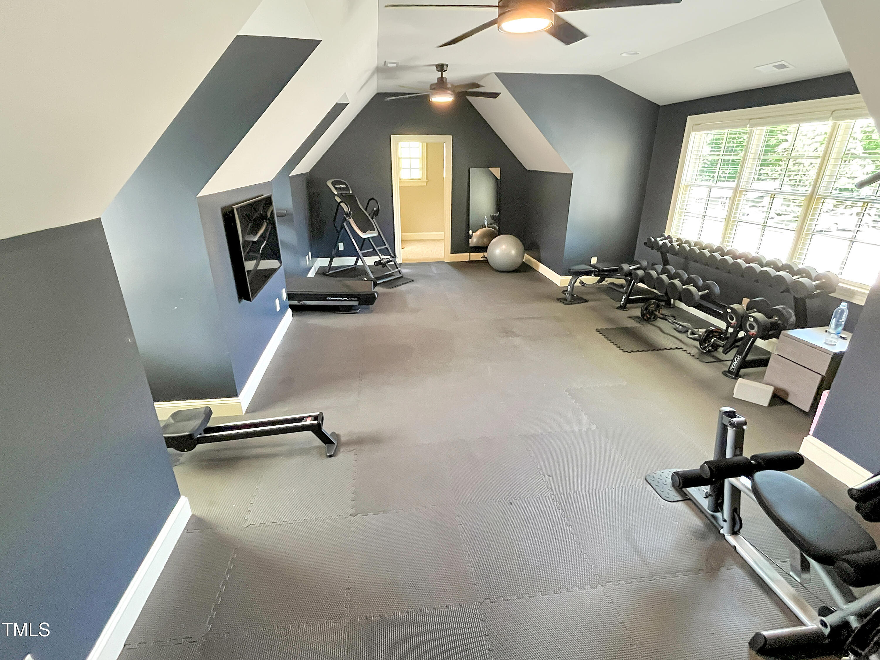 2908 Claremont Road Raleigh, NC 27608 - Photo 39 of 46 a room with gym equipment and a window