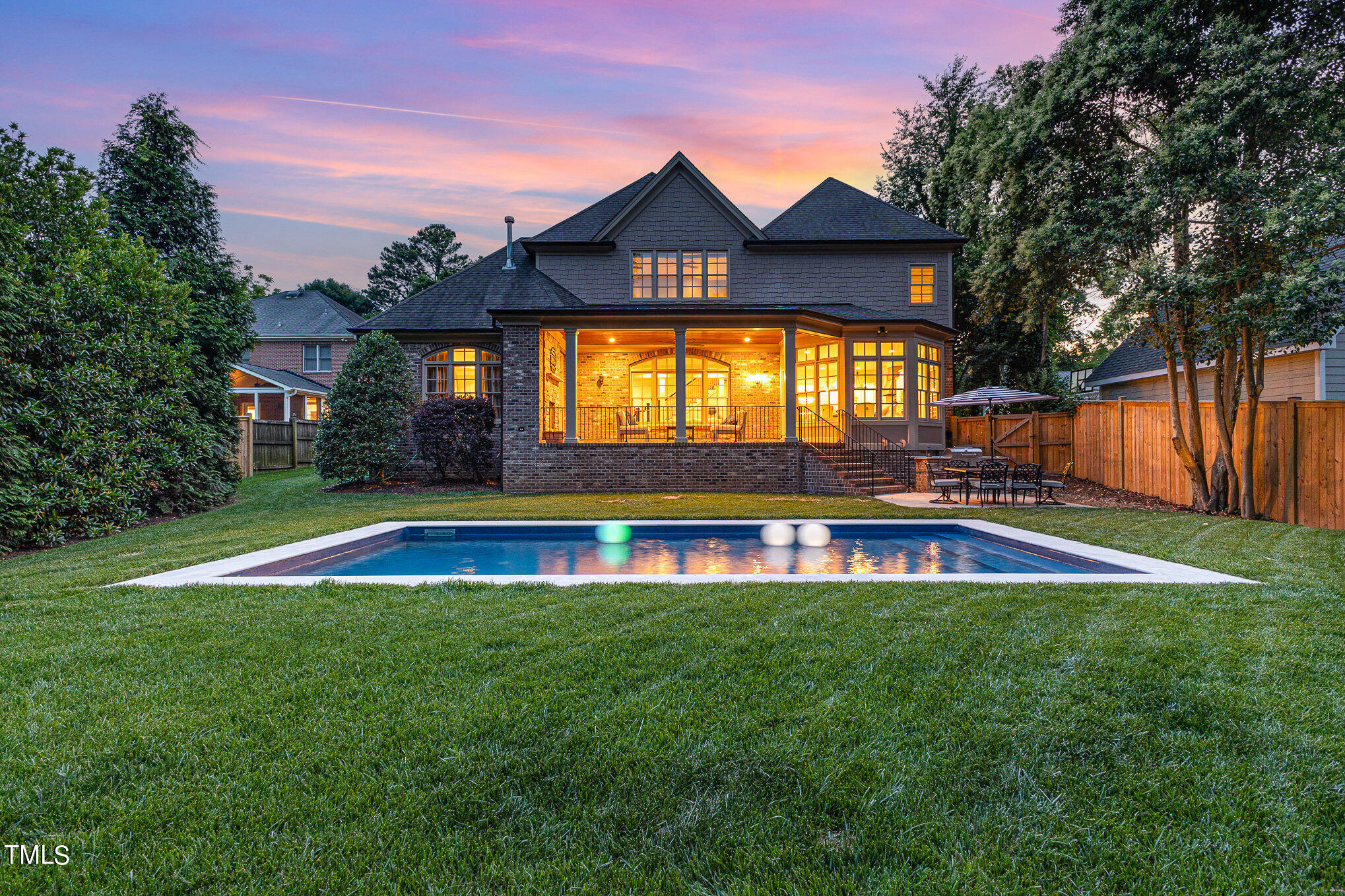 2908 Claremont Road Raleigh, NC 27608 - Photo 4 of 46 a view of an house with swimming pool and yard