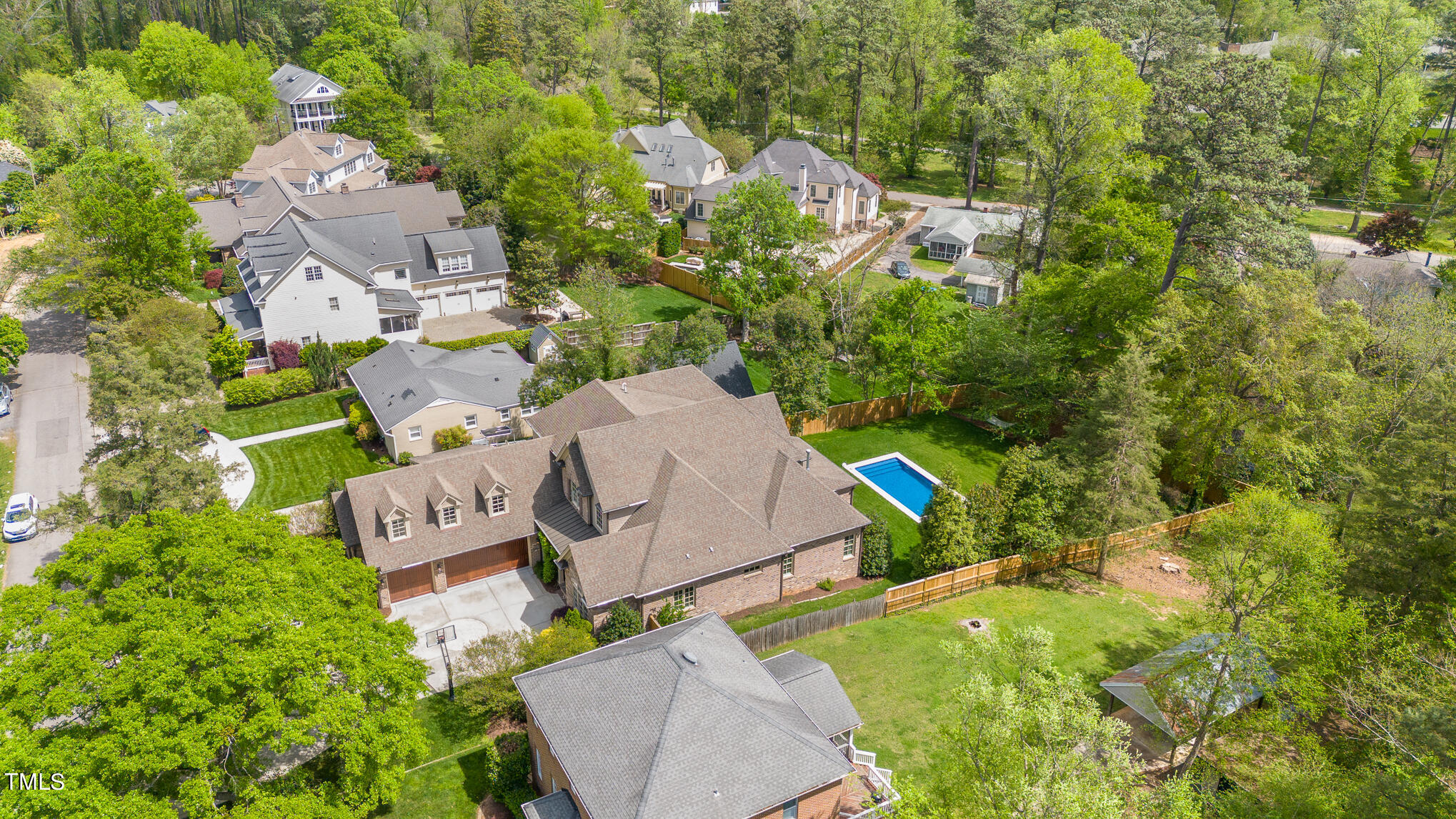 2908 Claremont Road Raleigh, NC 27608 - Photo 44 of 46 an aerial view of a house with swimming pool and garden space