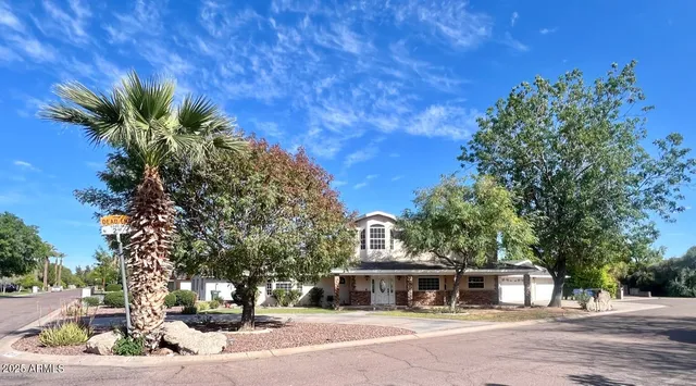 a view of house with outdoor space and garden