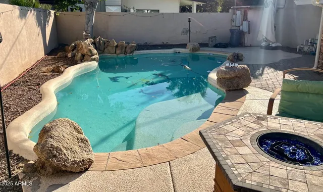 a backyard of a house with seating space