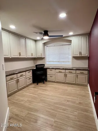 a large kitchen with stainless steel appliances granite countertop a stove and a sink