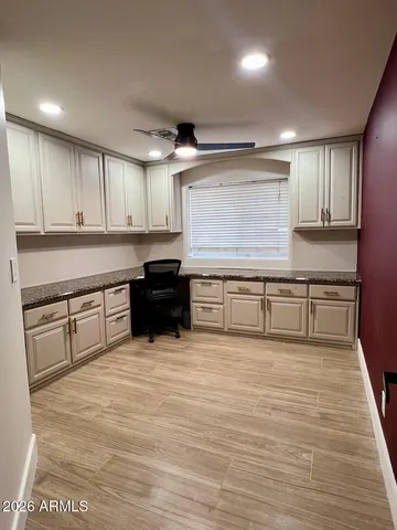 a large kitchen with stainless steel appliances granite countertop a stove and a sink