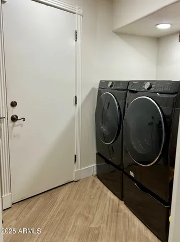 a utility room with dryer and washer
