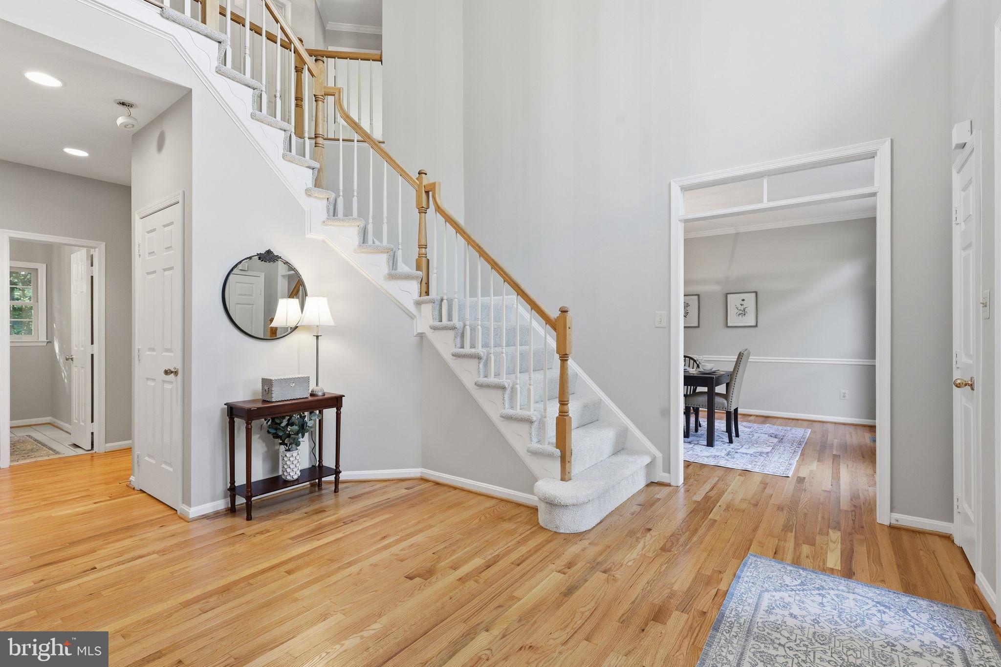 8556 Hooes Road Springfield, VA 22153 - Photo 3 of 57 Open 2 story foyer with refinished hardwood floors