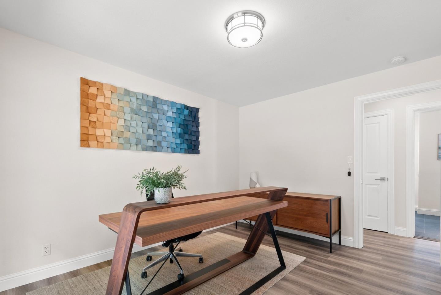 770 Graham Hill Road Santa Cruz, CA 95060 - Photo 48 of 83 a view of a workspace with furniture and wooden floor
