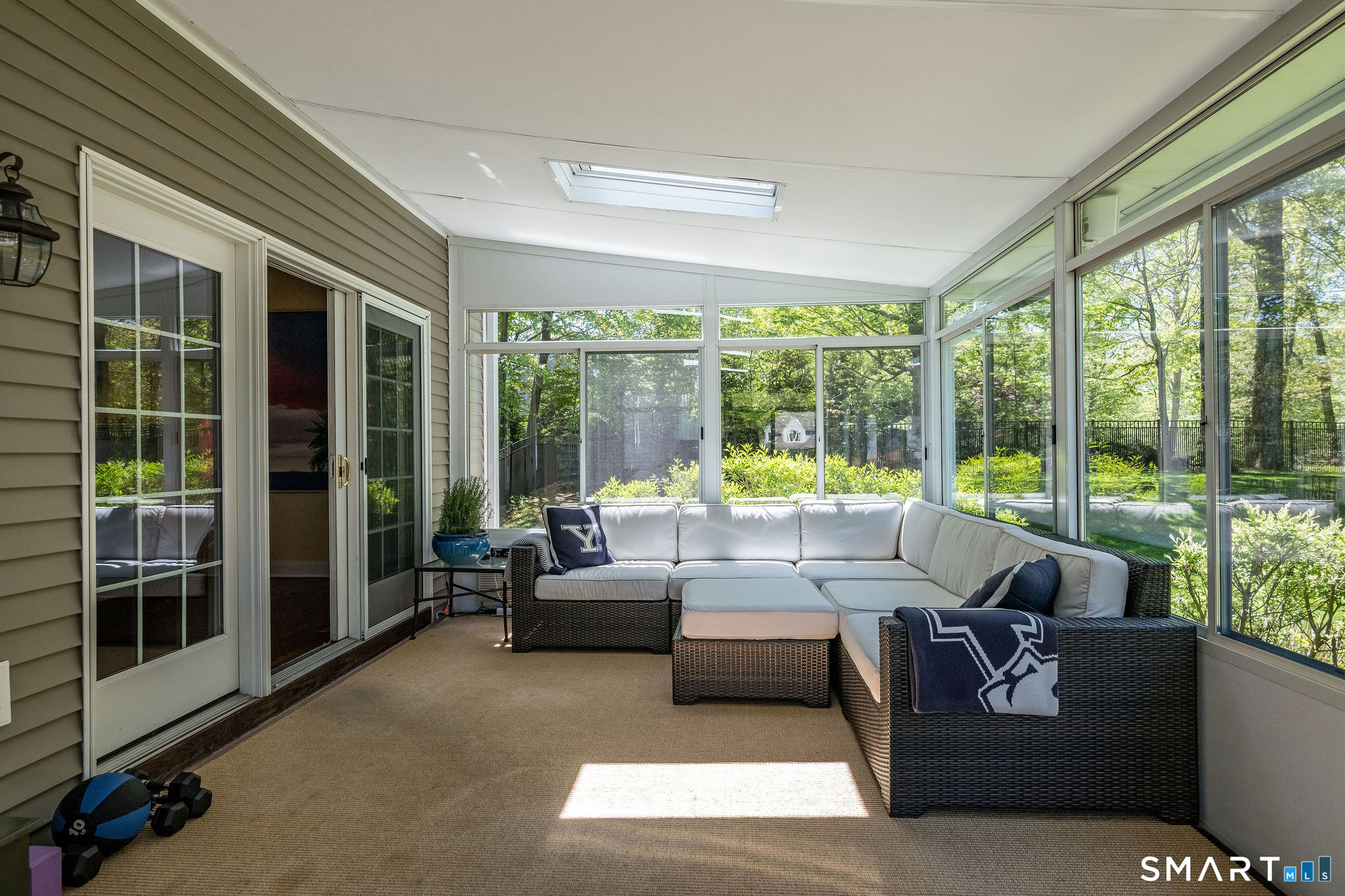170 Devonshire Lane Madison, CT 06443 - Photo 19 of 39 a living room with furniture and floor to ceiling windows