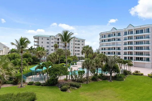 a view of house with outdoor space and swimming pool