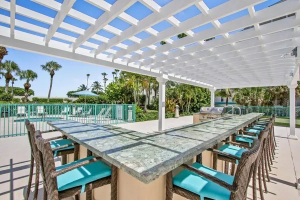 a view of a building and outdoor seating