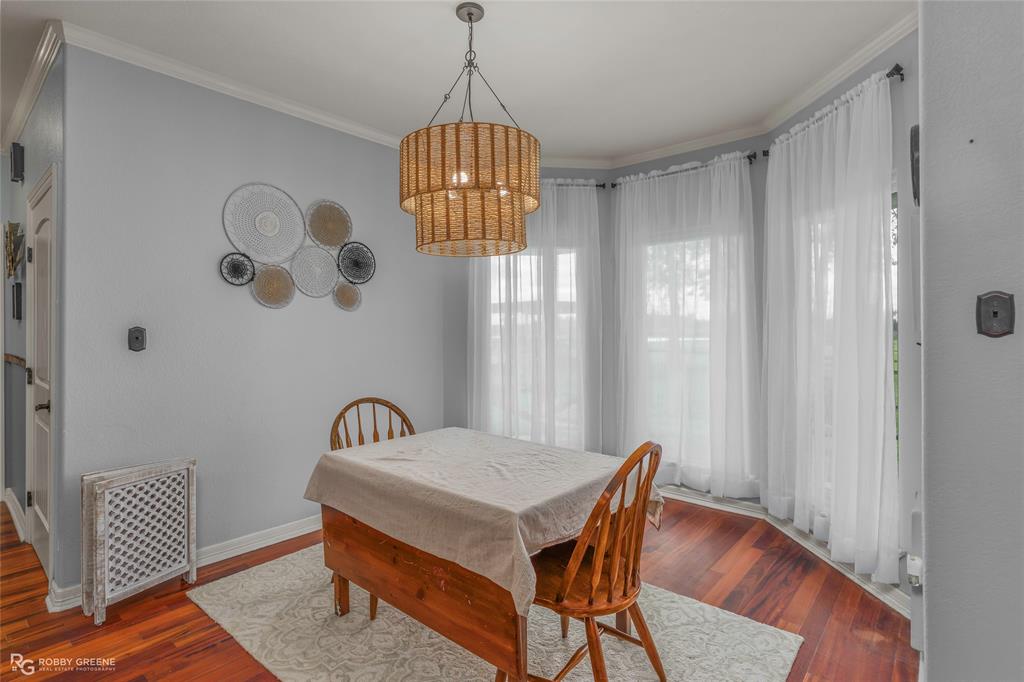 624 Holly Street Grand Cane, LA 71032 - Photo 11 of 40 Dining space with crown molding and wood finished floors