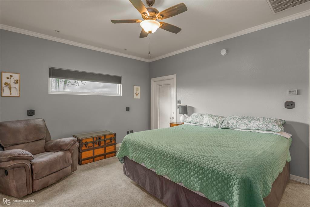 624 Holly Street Grand Cane, LA 71032 - Photo 12 of 40 Bedroom with light carpet, ornamental molding, and ceiling fan