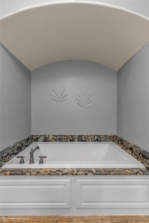 624 Holly Street Grand Cane, LA 71032 - Photo 15 of 40 Full bathroom featuring a garden tub and a barrel ceiling