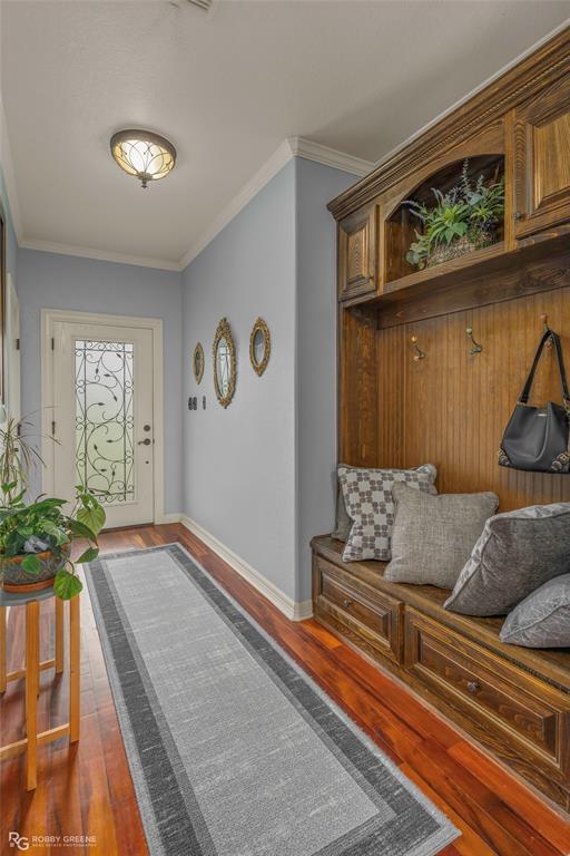 624 Holly Street Grand Cane, LA 71032 - Photo 2 of 40 Entrance foyer with ornamental molding and dark wood-type flooring