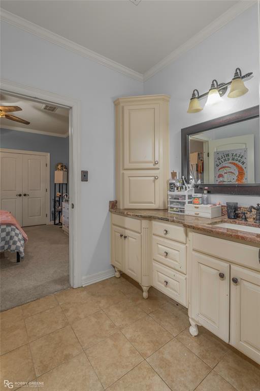 624 Holly Street Grand Cane, LA 71032 - Photo 24 of 40 Ensuite bathroom with vanity, ornamental molding, light colored carpet, and ceiling fan